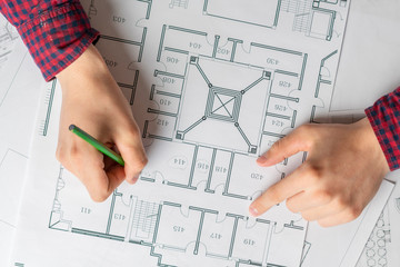 top view man drawing building architecture plan b