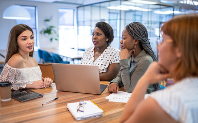 Creative team of woman brainstorming in a modern coworking space