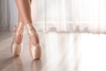 Young Ballet Dancer Wearing Pointe Shoes Indoors