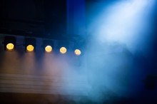 Theatrical Spotlights Illuminate The Stage During The Performance.