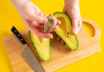 woman cutting fruit for lunch in the kitchen