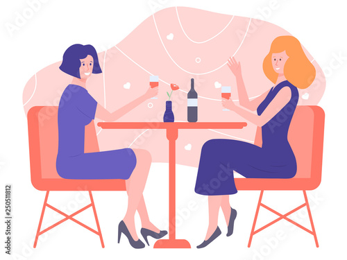Loving Couple Of Girls Sitting At A Table In A Restaurant Raised