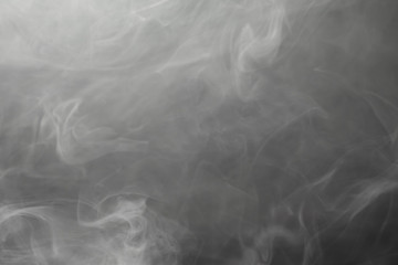 Wall Mural - dense smoke on black background