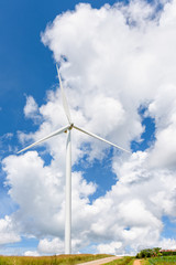 Windmill on sky background