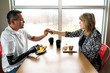 © Sarah Rypma - Husband with a robotic arm eats breakfast with his wife