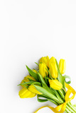 Fototapeta Tulipany - Spring composition. Bouquet yellow tulips on white background top view space for text