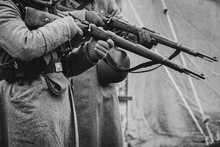 Two German Soldiers Of The Second World War With Rifles In Their Hands Ready To Fire. Black And White Photo
