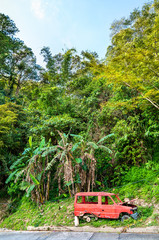 Canvas Print - Broken rusty car in Banaue village on Luzon island, Philippines