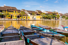 Boats Tied On The Dock Along The Riverbank Of The Thu Bon River In The Old Quarter Of Hoi An (Hội An), Vietnam. Hoi An Is A Popular Tourist Destination In Central Vietnam.