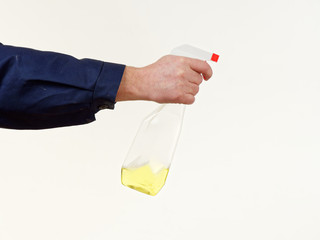 Wall Mural - man in working clothes holding a sprayer tool on white background.