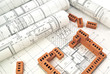 Bricks for building a house with design drawings