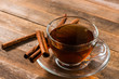 a cup of cinnamon tea on wooden table
