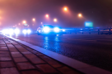 lights and light traces on road at night and in the fog