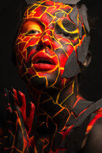 Girl With A Painted Face On A Black Background. Body Art In The Form Of A Devil