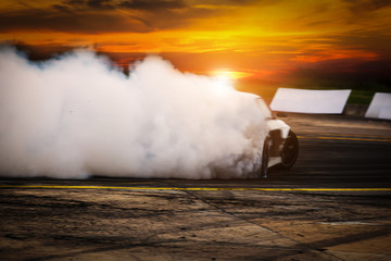 Blurred Race car drifting on speed track on twilight background.