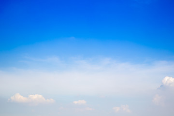 Wall Mural - Beautiful blue sky with a small group of clouds background.