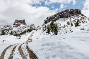 Beatiful path covered in the snow in the Falzarego pass, dolomites in Italy, on the way to Cinque Torri