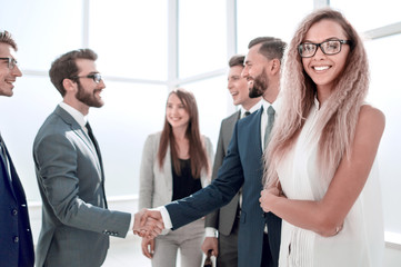 business partners shaking hands when meeting in the office
