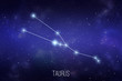 Taurus zodiac constellation on a starry space background with lettering