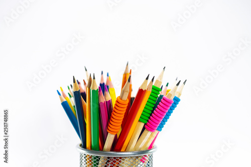 Fotografía Colored pencils in a pencil case on white background
