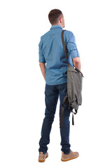 Canvas Print - Back view of a man with a green bag.