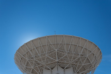 Wall Mural - very large array backlit radio astronomy observatory dish in clear sky, science technology space, ho