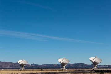 Wall Mural - very large array three very large radio telescope dishes in the new mexico desert, winter, copy spac