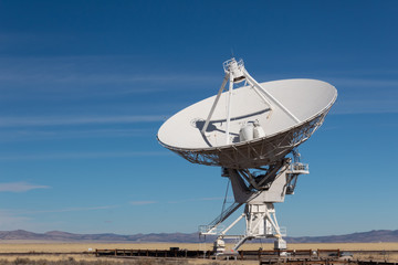 Wall Mural - very large array vla radio antenna dish against a blue sky in the new mexico desert, technology spac