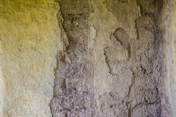 Earthen wall for background. An earth house, also known as earth berm, earth sheltered home, or eco-house is an architectural style by use the natural terrain to help form the walls of a house.