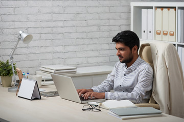 Young businessman working in office