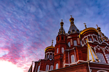 Church on the background of a beautiful sunset. Easter holiday for Christians