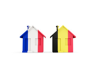 Two houses with flags of France and belgium