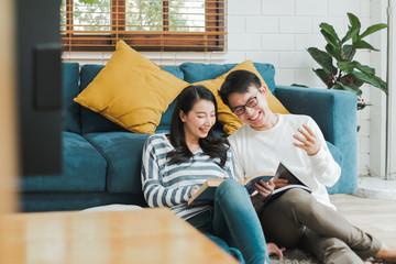 Lifestyle Asian couple man and woman talking working  spend time together at home, Asian couple family lifestyle concept