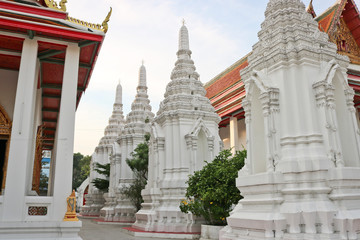 Beautiful buddhist wat temple with white tombs