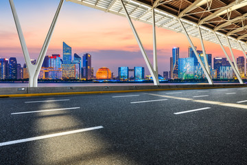 Empty asphalt road through Hangzhou business district