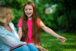 © InfiniteFlow - Happy mother and little kid daughter in park.