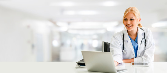 Doctor using laptop computer at the hospital.