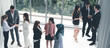© InfiniteFlow - Many business people gathering in office building.