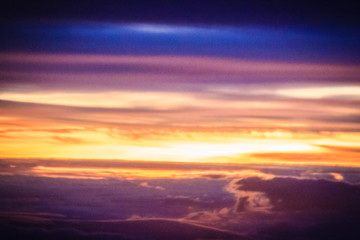 Wall Mural - Dusk sky and cloud at morning dawn background. Vibrant colors of the sky with clouds from dusk till dawn. Dramatic evening cloudscape in the city. Twilight sky began to change from blue to orange.