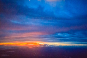 Wall Mural - Dusk sky and cloud at morning dawn background. Vibrant colors of the sky with clouds from dusk till dawn. Dramatic evening cloudscape in the city. Twilight sky began to change from blue to orange.