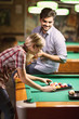 © luckybusiness - couple sorting balls for beginning billiard game .