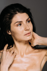 Wall Mural - beautiful nude girl with freckles on face isolated on grey