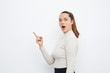 © Martin Villadsen - young brunette pointing at product copy space