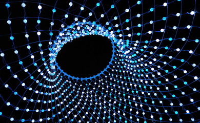 Wall Mural - Colorful lights in a circle shaped net