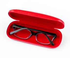 Glasses in red case on a white background