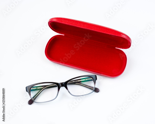 Fotografía Glasses and red case on a white background