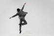 © master1305 - Happy businessman dancing in motion isolated on white studio background. Flexibility and grace in business. Human emotions concept. Office, success, professional, happiness, expression concepts