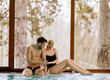 © BGStock72 - Loving couple relaxing in the spa by swimming pool