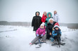 © Cavan Images - Portrait of family in meadow in winter