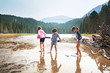 © Cavan Images - Children wading through river